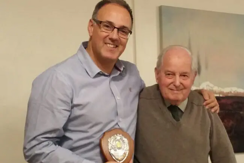 Geoff Lawrence presenting Adrian England with an award