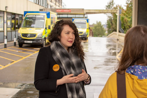 Victoria Collins talking to residents about the NHS