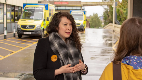 Victoria Collins talking to residents about the NHS